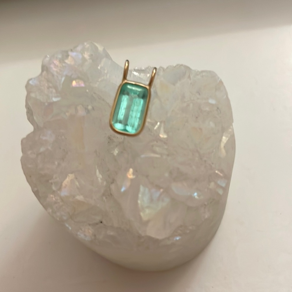 Emerald pendant wire wrapped in 14k yellow gold